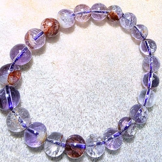 High Grade Super Seven (Melody Stone) 8mm Bead Bracelet