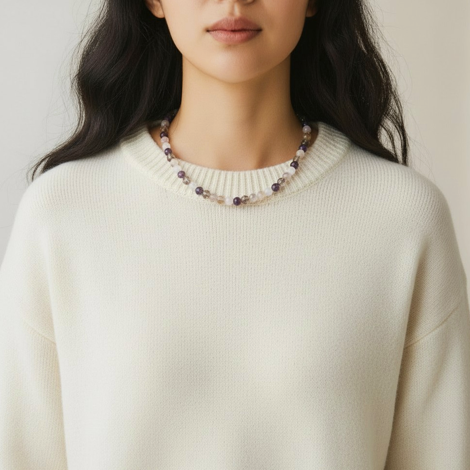 model wearing crystal necklace with amethyst, rose quartz