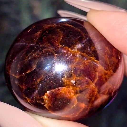 Extra Grade Garnet Sphere with Blue Star Asterisms