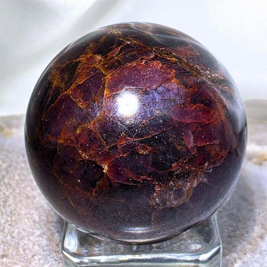 Extra Grade Garnet Sphere with Blue Star Asterisms