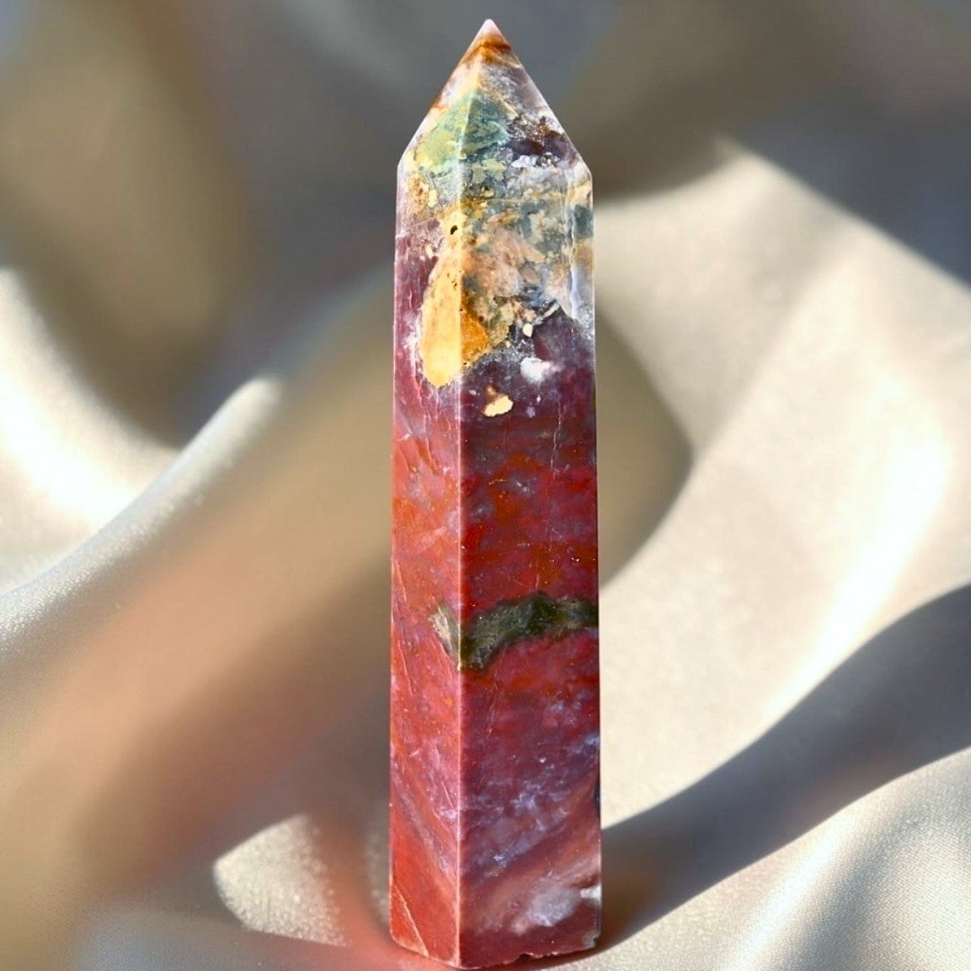 Genuine Ocean Jasper crystal tower from Madagascar with natural orbicular patterns in green, cream and pink tones.