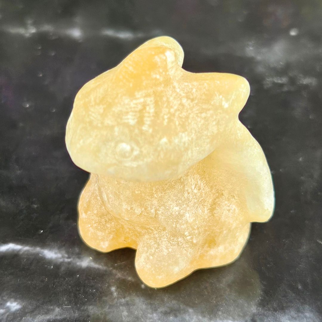 Yellow Calcite Toothless Carving