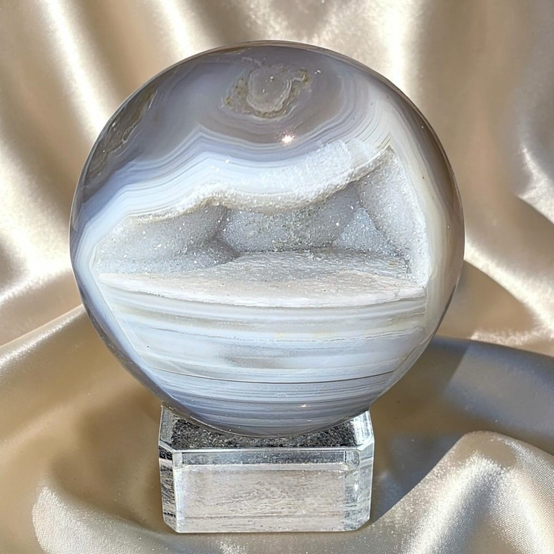 High grade natural Agate sphere with a sparkling druzy cavity, botryoidal Quartz and grey-blue banding.