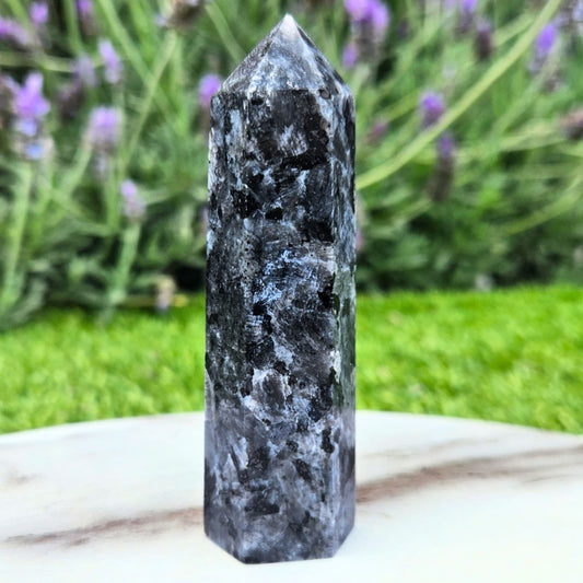 Larvikite crystal showing natural blue flash with reflective feldspar from Norway