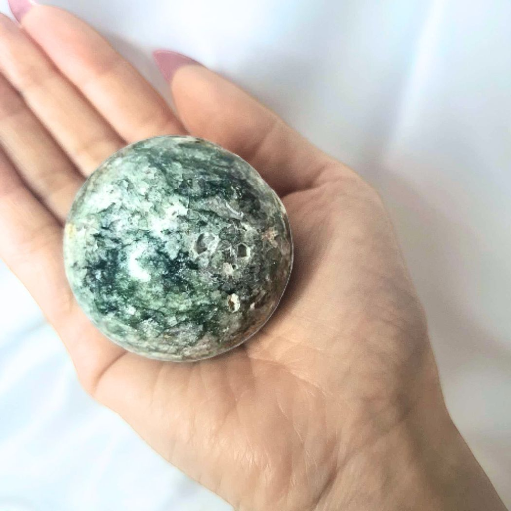 Moss Agate Sphere with Natural Openings - includes stand