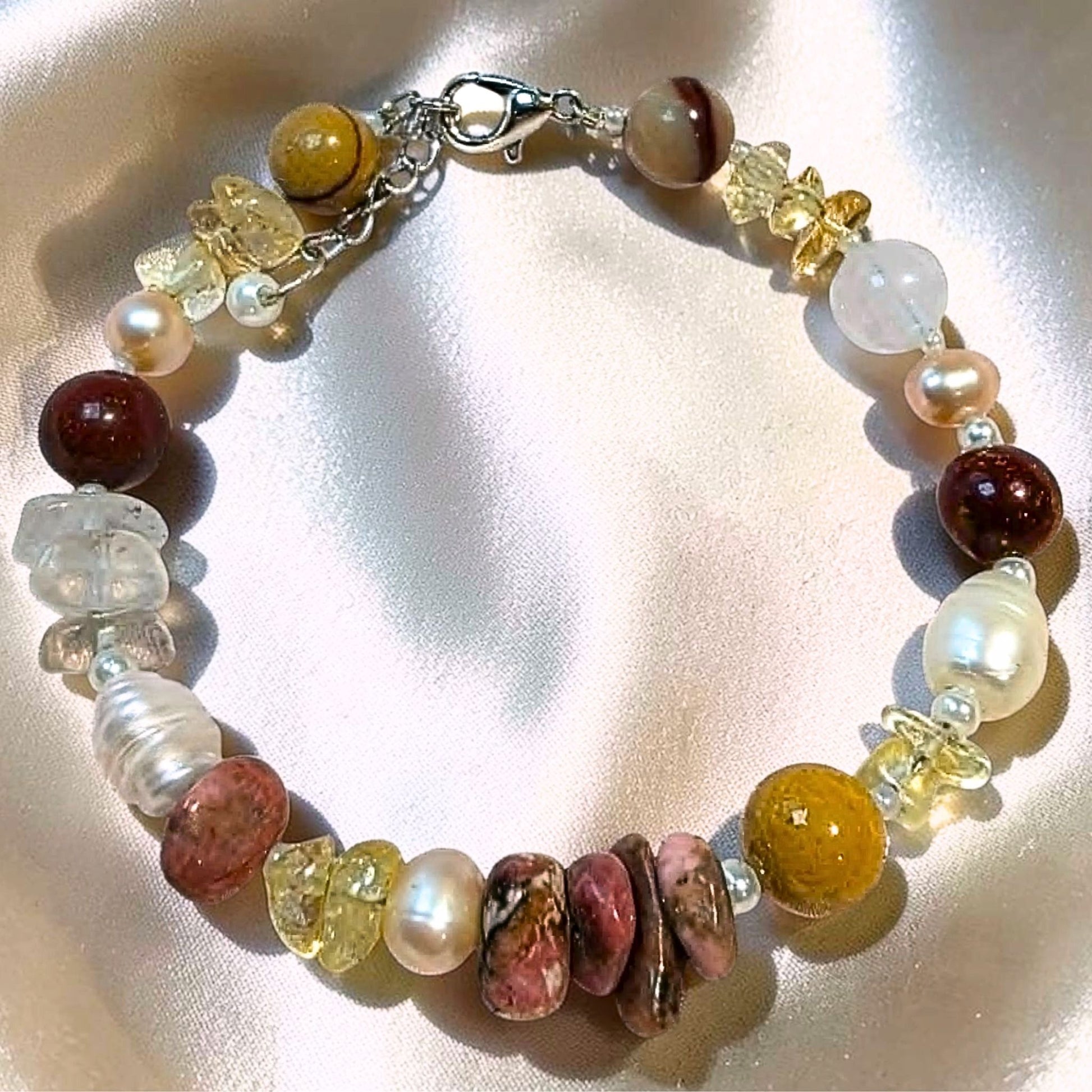 Handcrafted Solar Horizon gemstone bracelet made in Melbourne, Australia, featuring genuine citrine, earthy mookaite, pink rhodonite, and freshwater pearls.