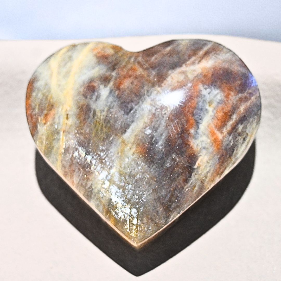 Large Puffy Sunstone with Rainbow Moonstone Heart Carving - includes stand