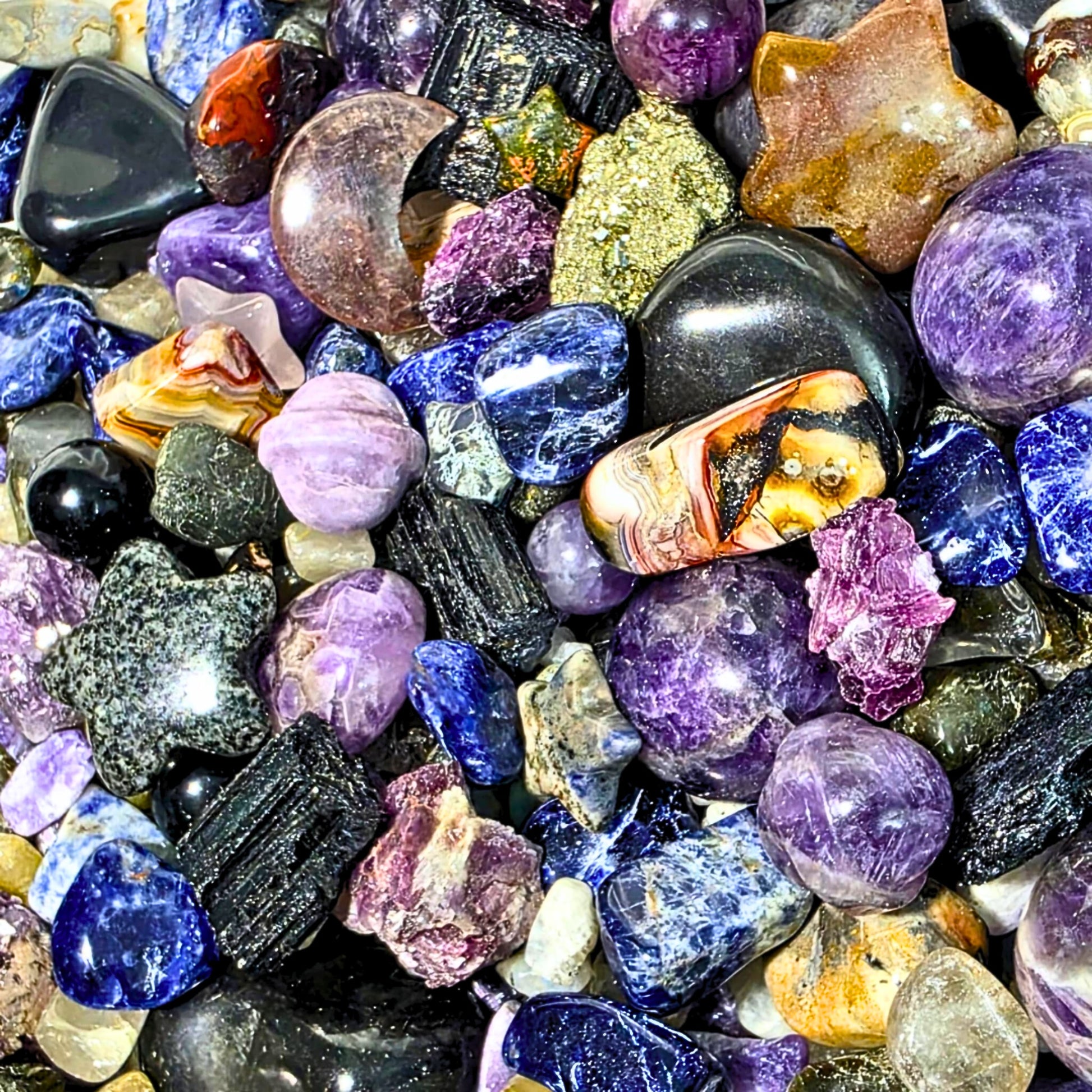 Galaxy Crystal Confetti Scoop containing mixed crystal tumbles, crystal chips, raw minerals and mini carvings