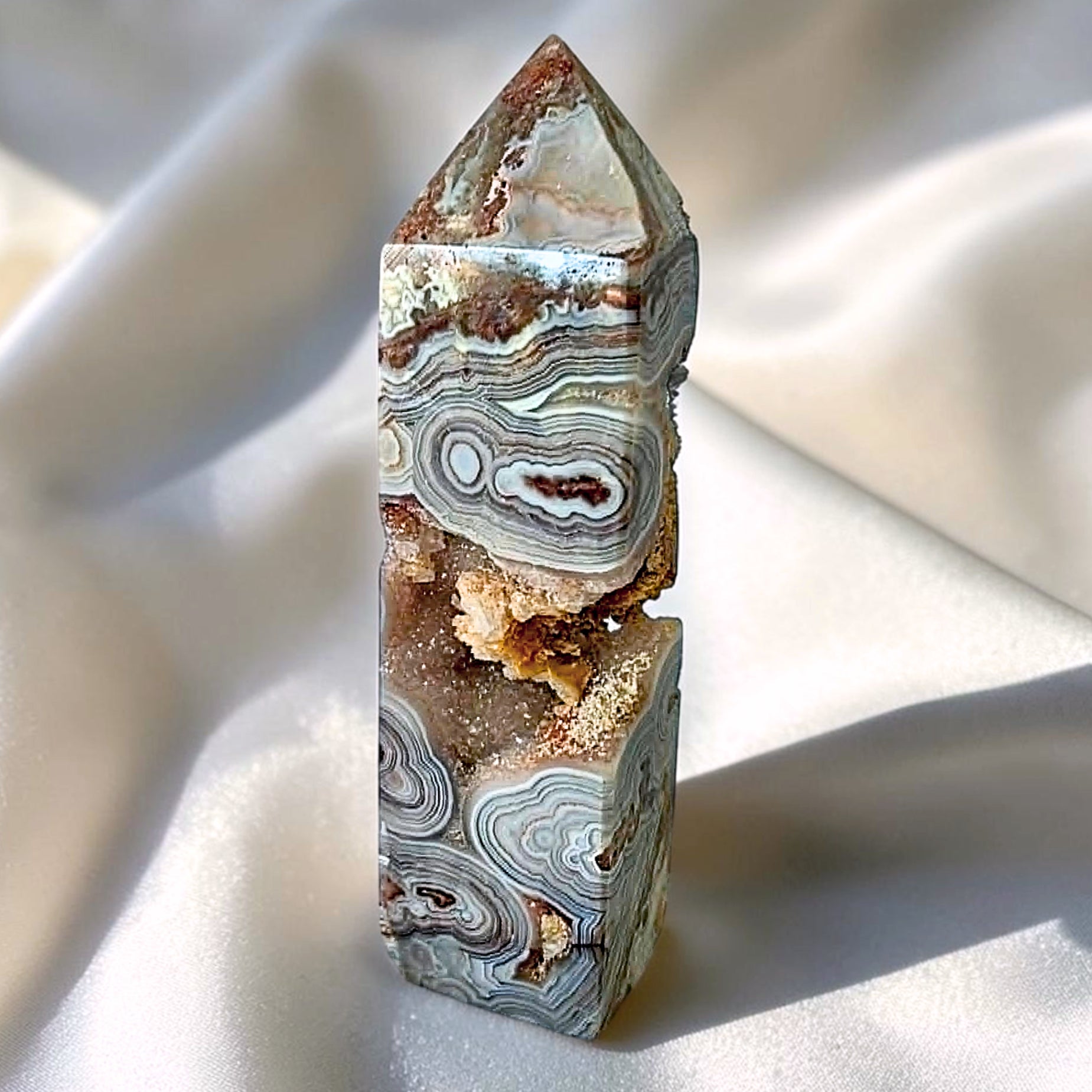 Natural Crazy Lace Agate crystal tower with druzy Quartz opening, grey lace banding and orbicular patterns from Mexico
