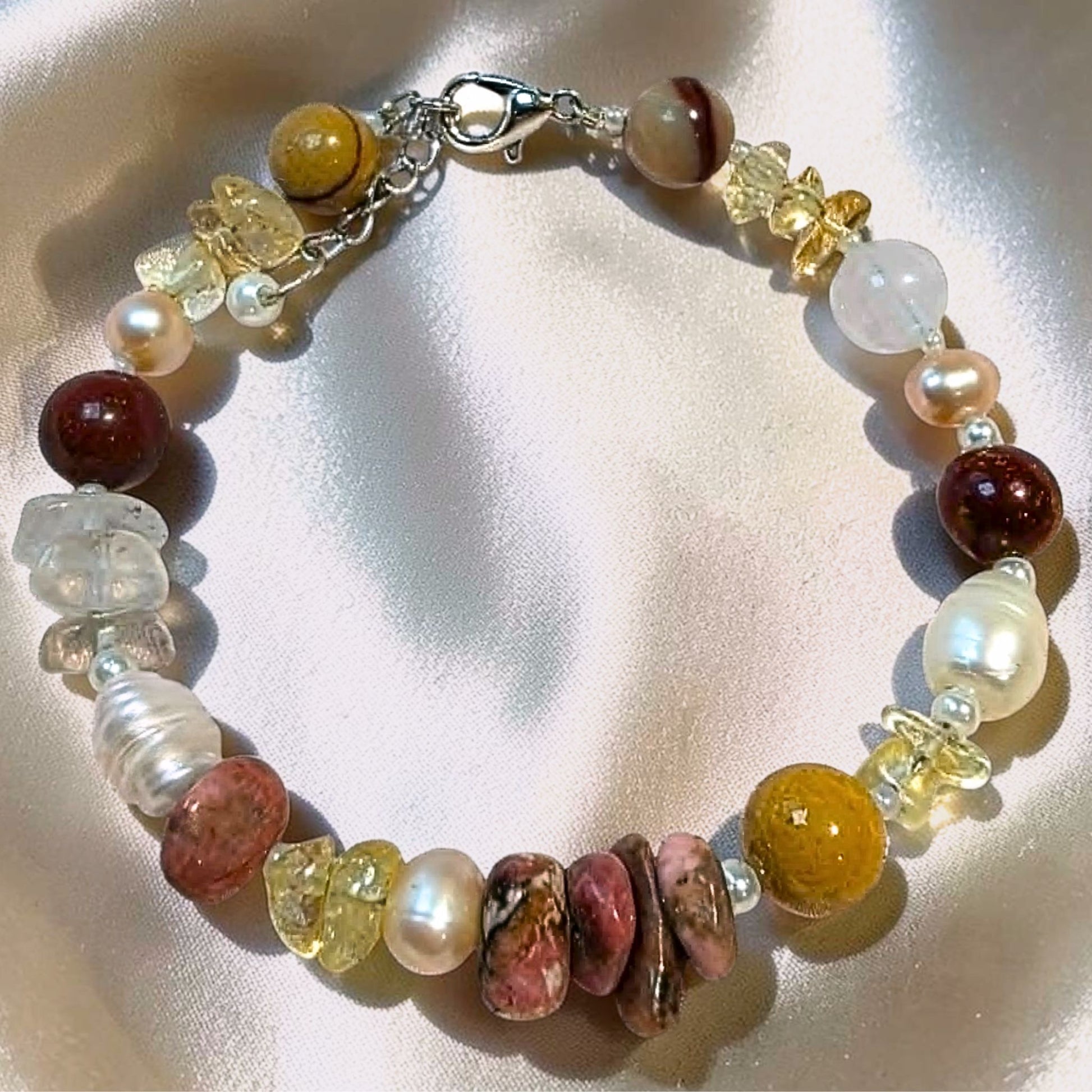 Handcrafted Solar Horizon crystal bracelet featuring natural Citrine chips, Rhodonite chips, and Australian Mookaite Jasper.