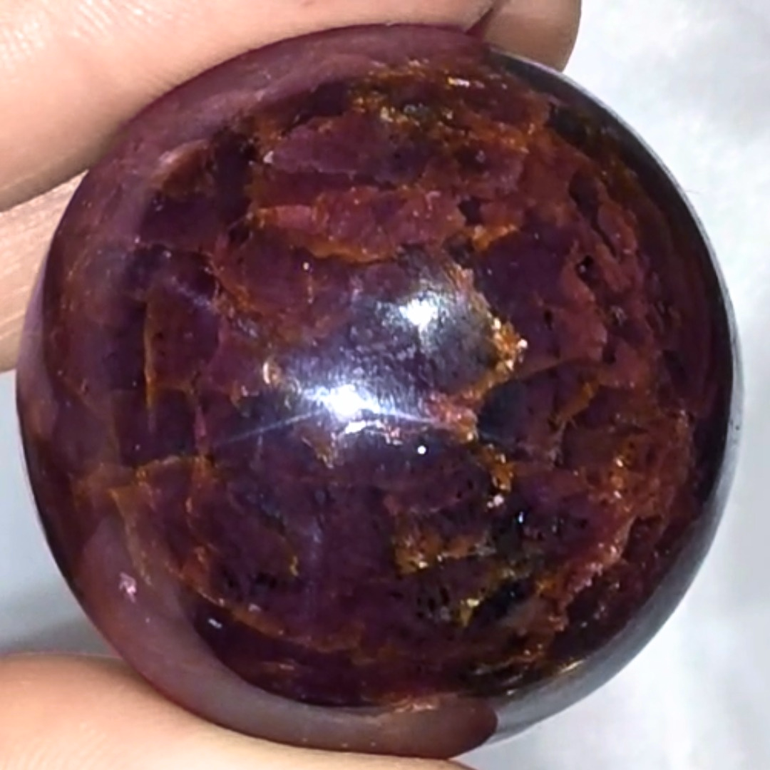 Extra Grade Garnet Sphere with Blue Star Asterisms